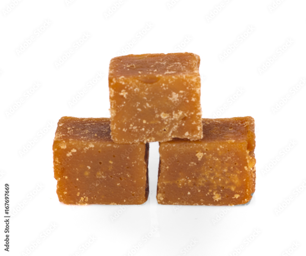 The palm sugar or Jaggery on white background The palm sugar or Jaggery on white background