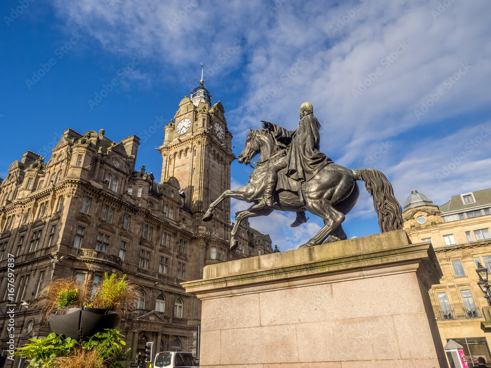 Duke of Wellington statue in Edinburgh, Scotland. The Scottish archives are located in the background.