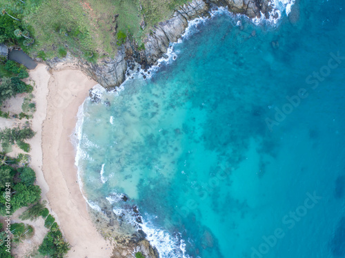 Sea aerial view,Top view,amazing nature background.The color of the water and beautifully bright.Azure beach with rocky mountains and clear water of Thailand ocean at sunny day. © MAGNIFIER