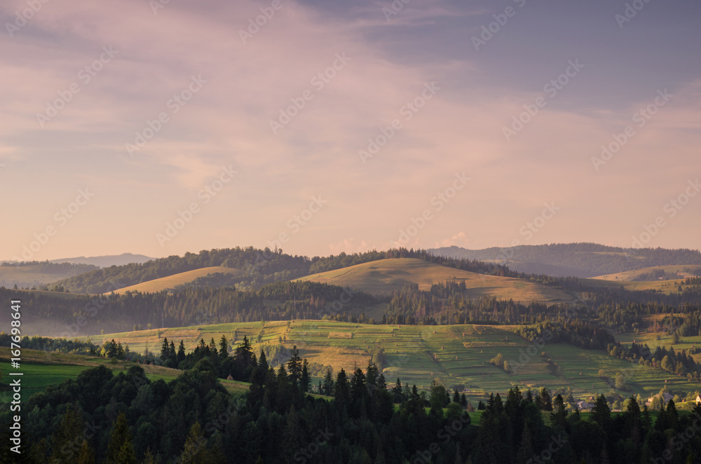 Background with Ukrainian Carpathian Mountains during the sunset in the Pylypets