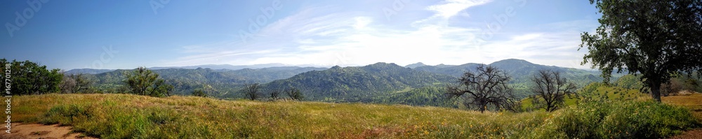 Panoramic view of the Sierra Nevada mountains from a hilltop in spring time. Near Sequoias National Park.