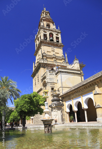 CORDOBA, SPAIN - JUNE 30, 2017: Interior garden and Bell Tower of Cathedral of Cordoba whose ecclesiastical name is the Cathedral of Our Lady of the Assumption one of most famous attractions in Spain.
