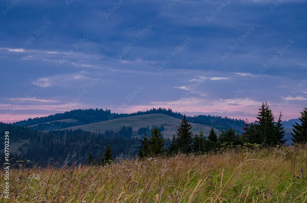 Background with Ukrainian Carpathian Mountains during the sunset in the Pylypets Background with Ukrainian Carpathian Mountains during the sunset in the Pylypets