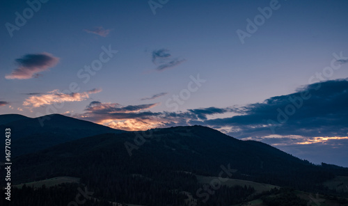 Background with Ukrainian Carpathian Mountains during the sunset in the Pylypets © thaarey1986