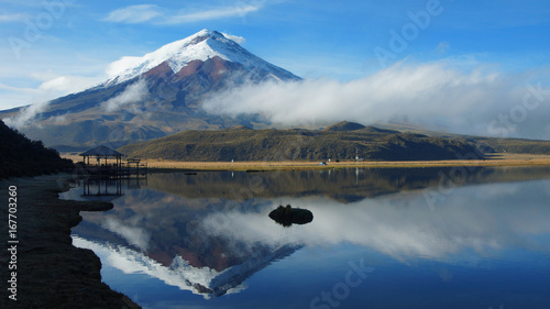 View of the Limpiopungo lagoon with the Cotopaxi volcano reflected in the water on a cloudy morning - Ecuador photo