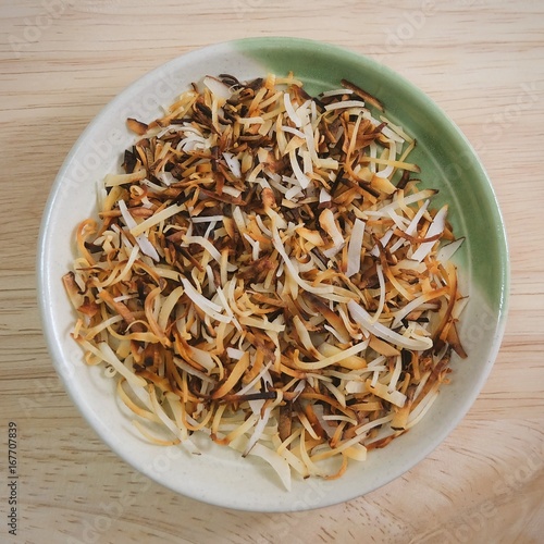 Roasted Coconut Flakes in A Round Dish