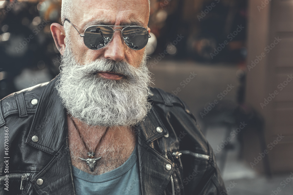Confident bearded man near garage