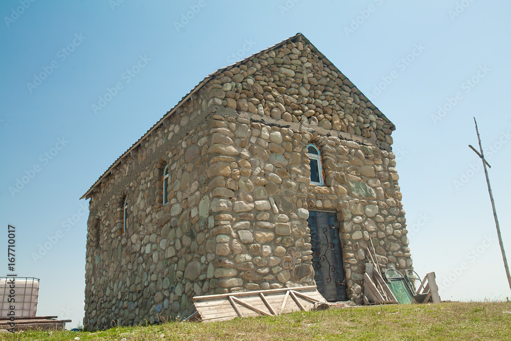 Fototapeta premium Old stone house in the mountains
