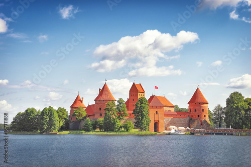 Trakai Castle in Lithuania on a bright sunny afternoon. Tourism in Vilnius. Trakai castle against blue sky with clouds