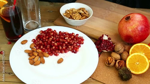 Wallpaper Mural A woman with her own hands puts walnuts on a plate. Hd shot with dolly .The camera moves from right to left.. Torontodigital.ca