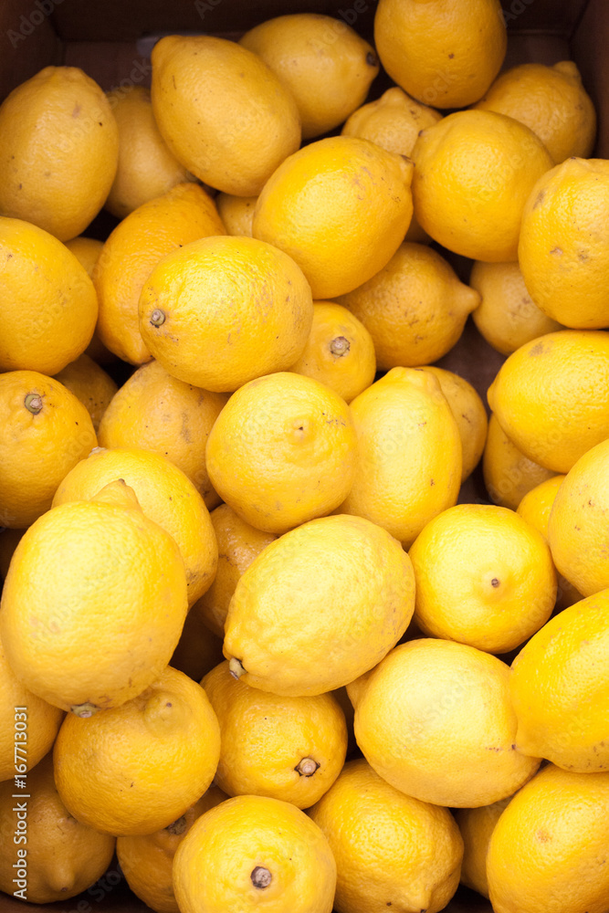Colorful Display Of Lemons In Market Lemons background