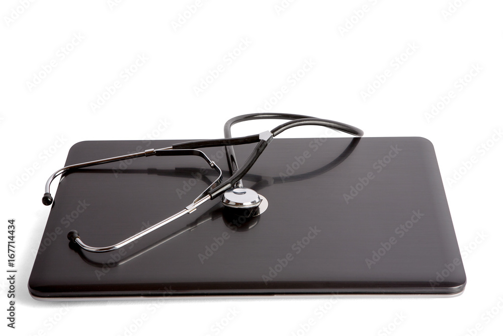 Stethoscope on laptop isolated on white background. Clipping path included. Stethoscope on laptop isolated on white background. Clipping path included.