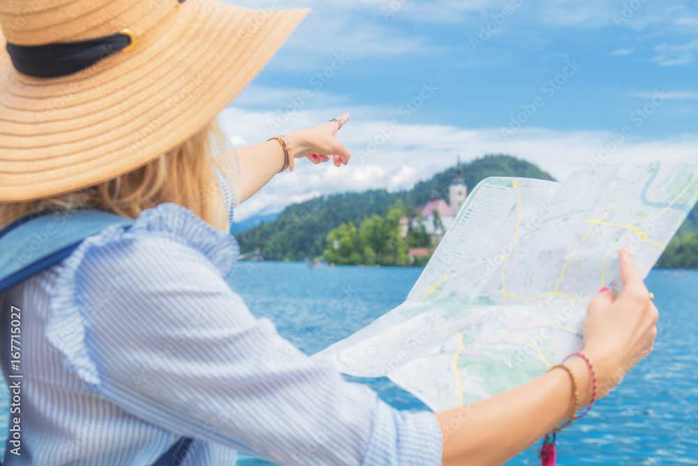 Fototapeta premium Tourist with a map enjoying the summertime.