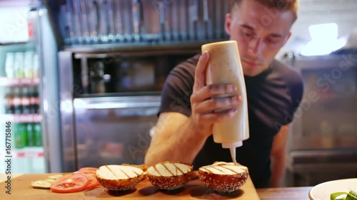 A modern chef prepares delicious American hamburgers