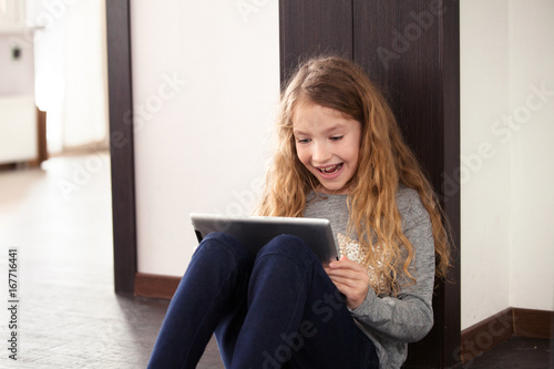 Child playing at tablet