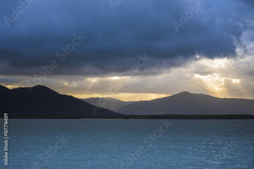 Dramatic sky on sea with mountains on the background