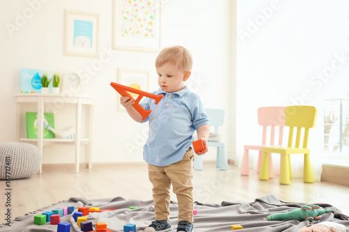 Cute little boy holding let...