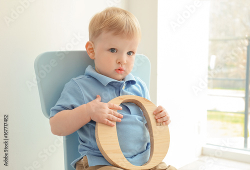 Cute little boy with letter...