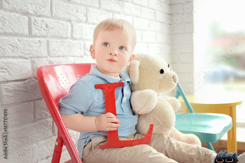 Cute little boy with letter...