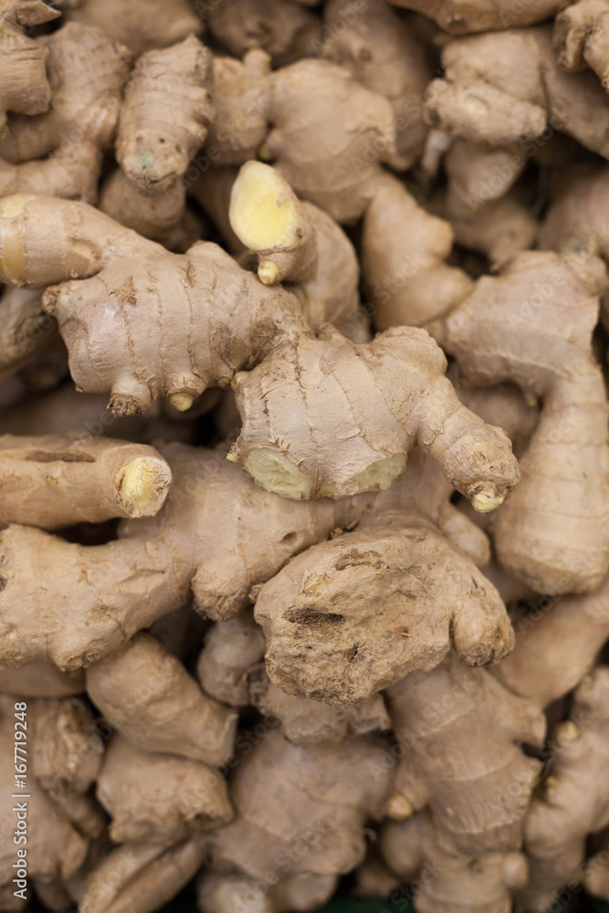heap of ginger root Ginger background A bunch of ginger on the counter of a vegetable supermarket for sale top view heap of ginger root Ginger background A bunch of ginger on the counter of a vegetable supermarket for sale top view