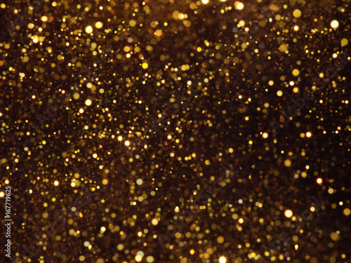 Golden overlay background of golden lights with bokeh effect.