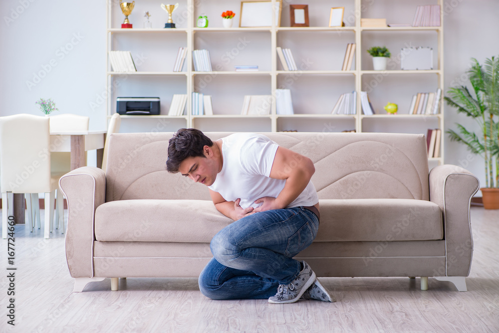 Man suffering from sick stomach and vomiting Man suffering from sick stomach and vomiting