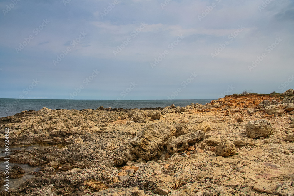 Rocky beach in the vicinity of Abramov Bay Rocky beach in the vicinity of Abramov Bay