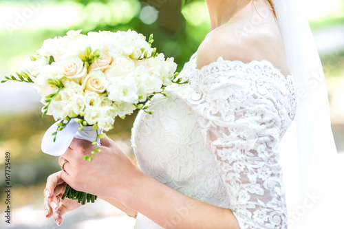 Bouquet in bride's hands photo