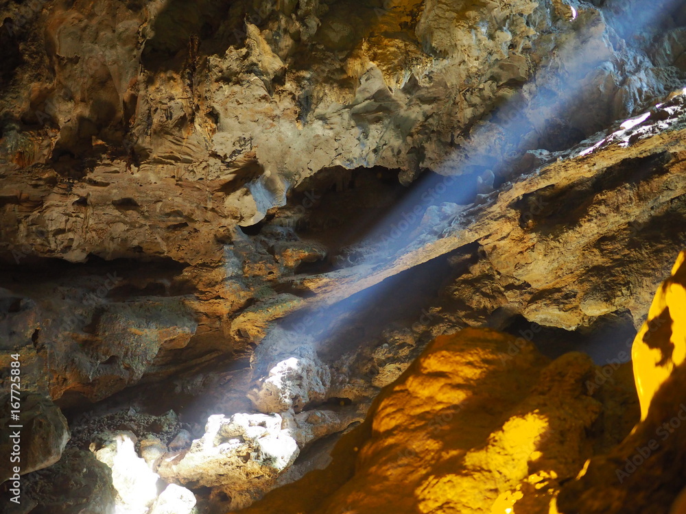 Sunlight shining through inside of Heaven cave in Ha long bay, Vietnam