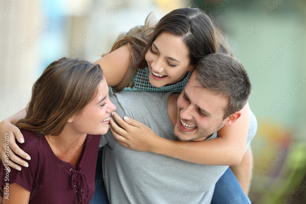 Three friends meeting and joking on the street Three friends meeting and joking on the street