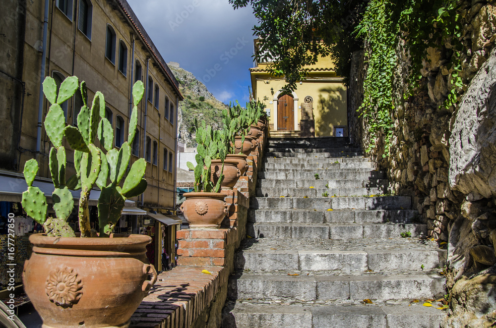 Fototapeta premium Detail street with stairs in the city of taormina