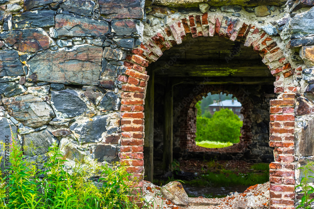 Wall made of stones. Entrance to the wall of natural stone. Wall made of stones. Entrance to the wall of natural stone.