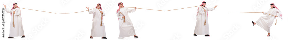 Arab in tug of war concept on white