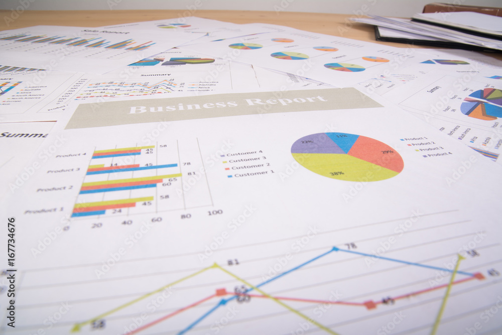 Business report. Graphs and charts. Business reports and pile of documents. Business concept. Business report. Graphs and charts. Business reports and pile of documents. Business concept.
