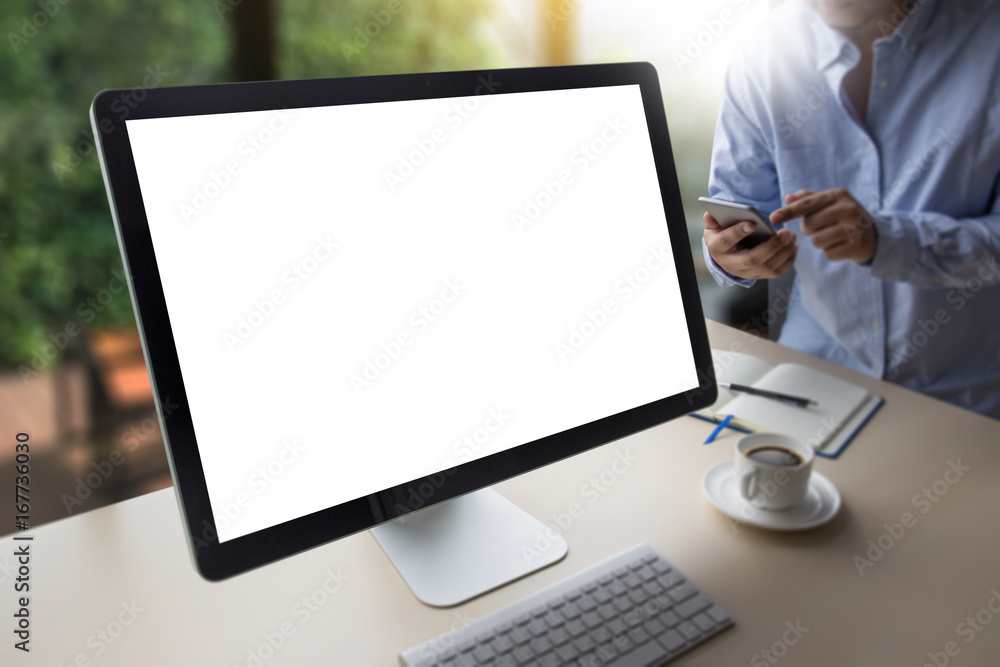 Fototapeta premium young man working Businessman using a desktop computer of the blank screen