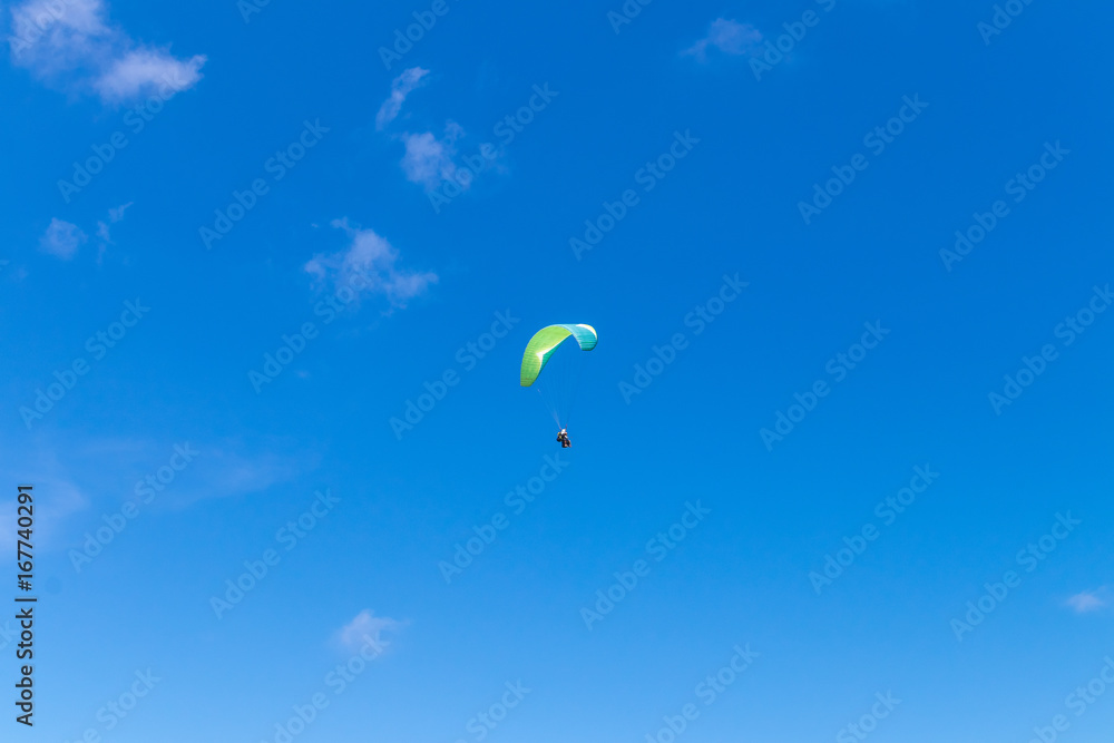 Raraplane flying in the beautiful sky. Tropical Bali island, Indonesia. Extreme sport. Raraplane flying in the beautiful sky. Tropical Bali island, Indonesia. Extreme sport.