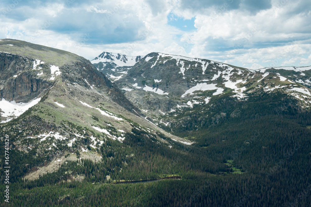 Mountain valleys and peaks of the Rocky Mountains. Cold summer in the mountains