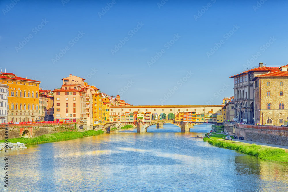 Obraz premium Ponte Vecchio is a bridge in Florence, located at the narrowest point of the Arno River, almost opposite the Uffizi Gallery.Italy.
