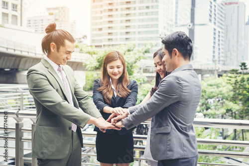 Close up of business people hands together. Teamwork concept. © Johnstocker