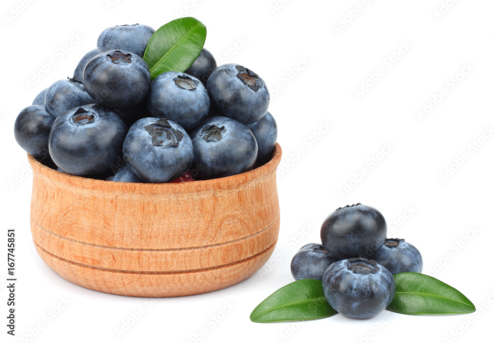 blueberries in wooden bowl isolated on white background blueberries in wooden bowl isolated on white background