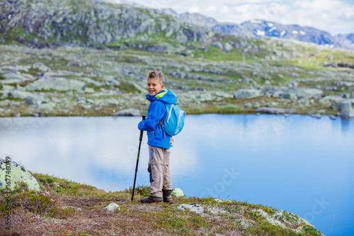 Cute boy with hiking equipment in the mountains © Max Topchii