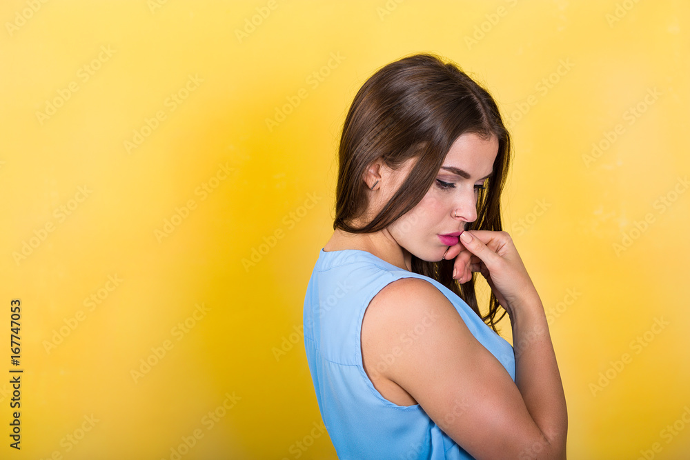 Pretty woman standing against bright background Pretty woman standing against bright background