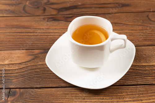 black tea cup on wooden table