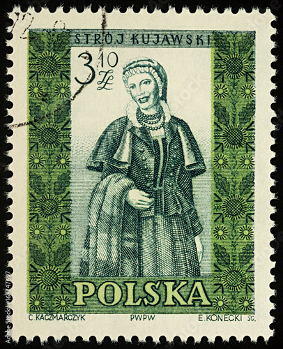 Woman in Polish traditional dress on postage stamp photo