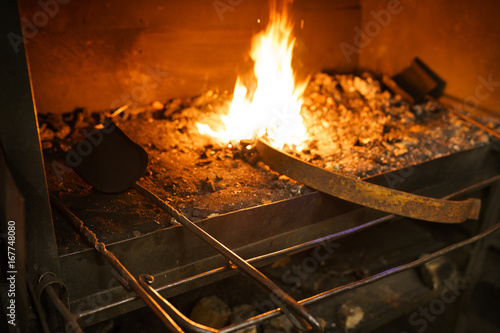 Blacksmith oven fire in workshop for metal heeting