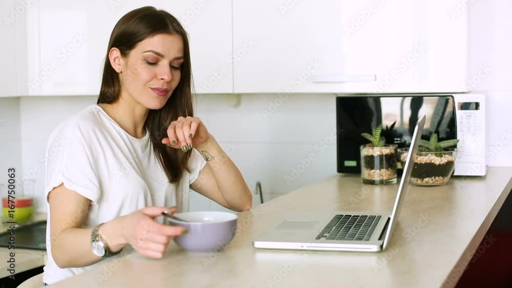 Woman at the laptop in the morning Woman at the laptop in the morning