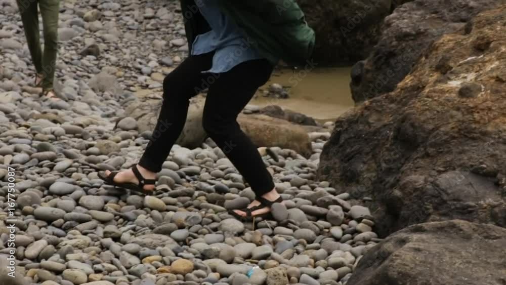 Tourists Explore Oregon Coast, One Jumps Down From Rock Onto Beach (Slow Motion) Tourists Explore Oregon Coast, One Jumps Down From Rock Onto Beach (Slow Motion)