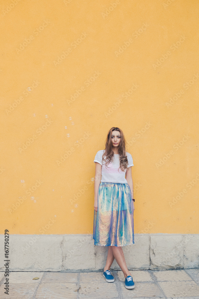 Fototapeta premium Young pretty girl posing in the street