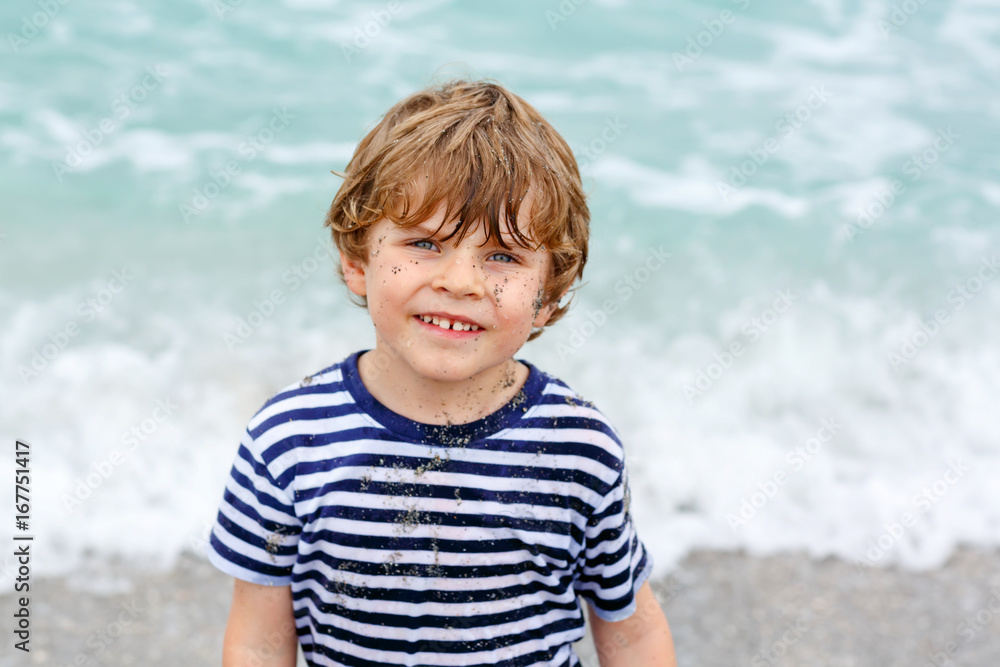 Little kid boy having fun on tropical beach Little kid boy having fun on tropical beach