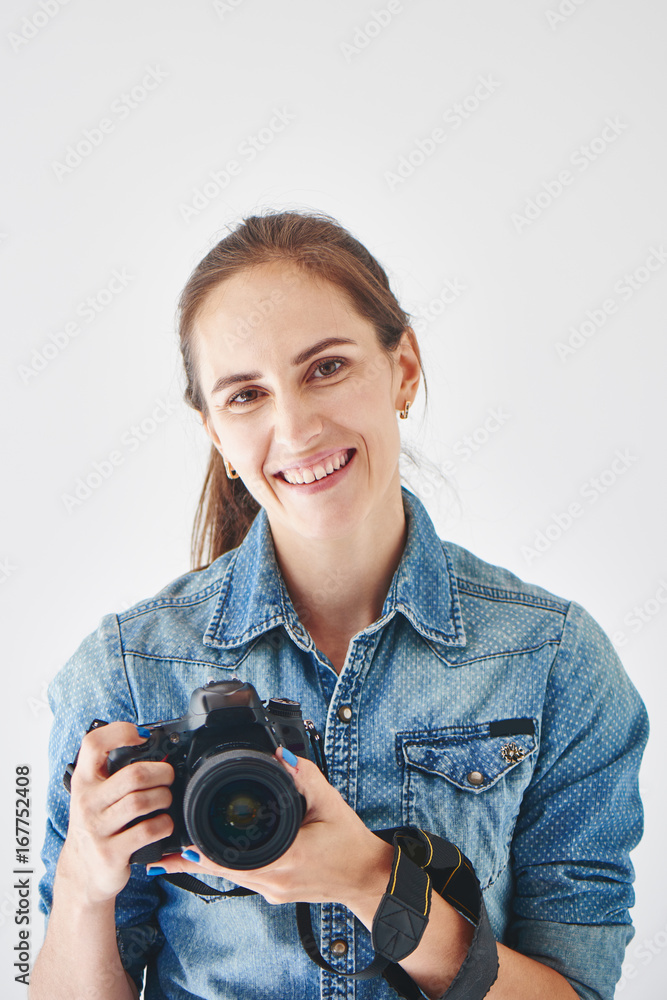 Portrait of a girl photographer on a white background Portrait of a girl photographer on a white background